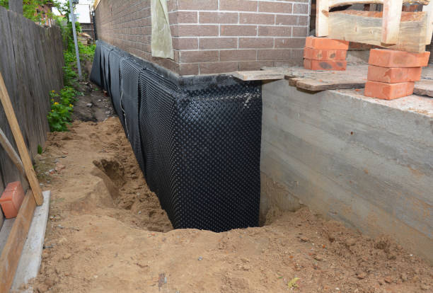 SJ Waterproofing Pros technician performing targeted Waterproofing assessment in Turon, KS